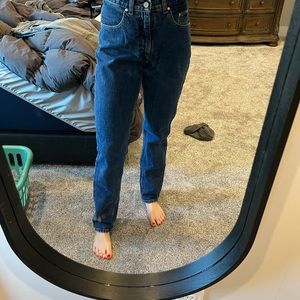 Dark blue straight leg jeans.